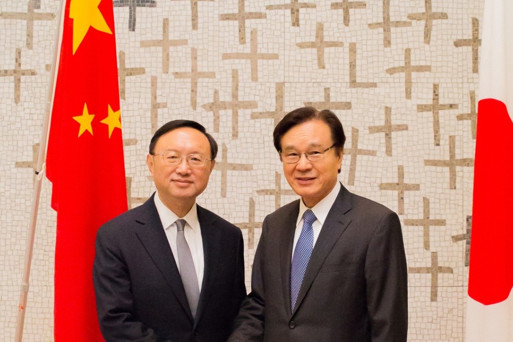 Chinese State Councillor Yang Jiechi (left) pictured in Tokyo with Japan's National Security Advisor Shotaro Yachi. Photo: Xinhua