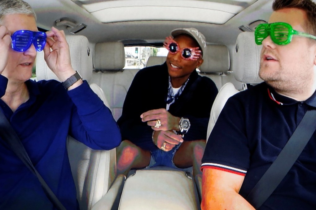 Apple Inc CEO Tim Cook is shown with TV personality James Corden and musician Pharrell during a taped comedy bit in this image shot from a projection screen during an Apple media event in San Francisco, California. Photo: Reuters