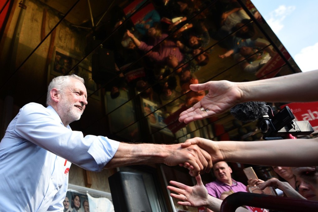 Britain's main opposition Labour Party leader Jeremy Corbyn shakes hands with supporters during a general election campaign event in Goole, northern England on May 22. Photo: AFP
