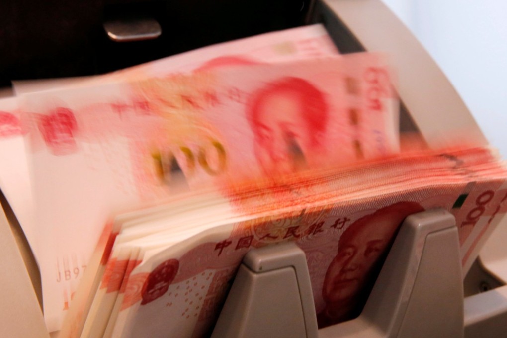 Chinese 100 yuan banknotes in a counting machine. Photo: Reuters