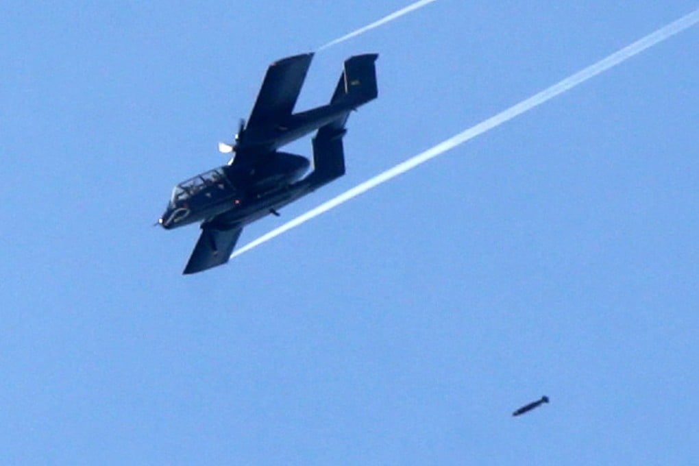 An OV-10 aircraft from the Philippine Air Force (PAF) drops a bomb over Marawi City. Photo: Xinhua