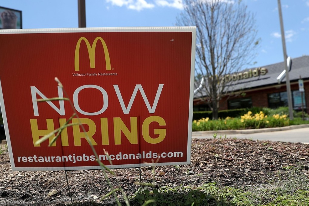 A now hiring sign posted in front of a McDonald's restaurant in Baton Rouge, Louisiana. A Fed survey showed the US economy grew modestly, but labour conditions remained tight. Photo: AFP