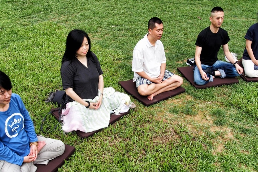 Professionals from different walks of life take part in a mindfulness retreat camp in Wu Kai Sha, Ma On Shan, in May 2013. But apart from face-to-face therapy, even online mindfulness and cognitive behavioural therapy training programmes can offer sustained benefits, a Chinese University study has shown. Photo: Thomas Yau