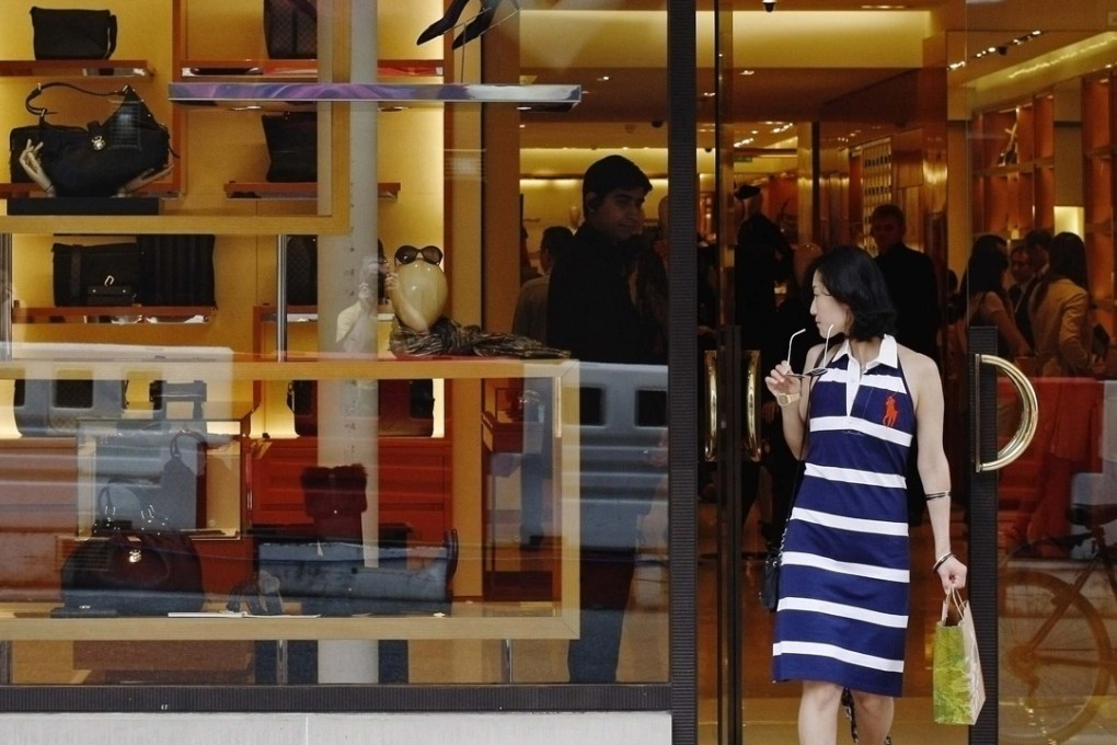 Chinese buying luxury goods overseas could easily spend more than 1,000 yuan in a transaction on their cards – and from September 2 their bank will have to report it. Photo: Reuters