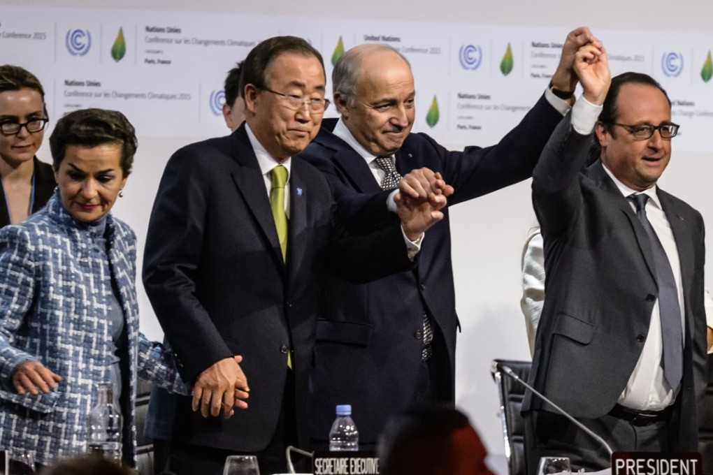 Executive secretary of the UN Framework Convention on Climate Change, Christiana Figueres, then UN secretary-general Ban Ki-moon, French foreign minister Laurent Fabius and president Francois Hollande celebrate after the adoption of the final agreement at the World Climate Change Conference near Paris on December 12, 2015. Photo: EPA