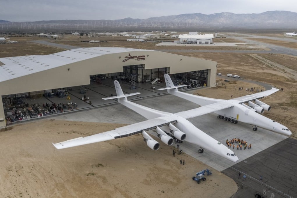 A handout photo made available on Thursday shows the Stratolaunch aircraft rolling out of its hangar for the first time ever in Mojave, California, on Wednesday. Photo: EPA