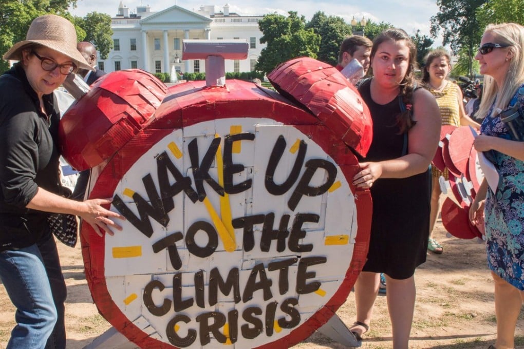 Protesters in Washington objecting to US President Donald Trump's decision to withdraw from the Paris climate accord. The move opens the door to China assume leadership in the global fight against climate change. Photo: AFP