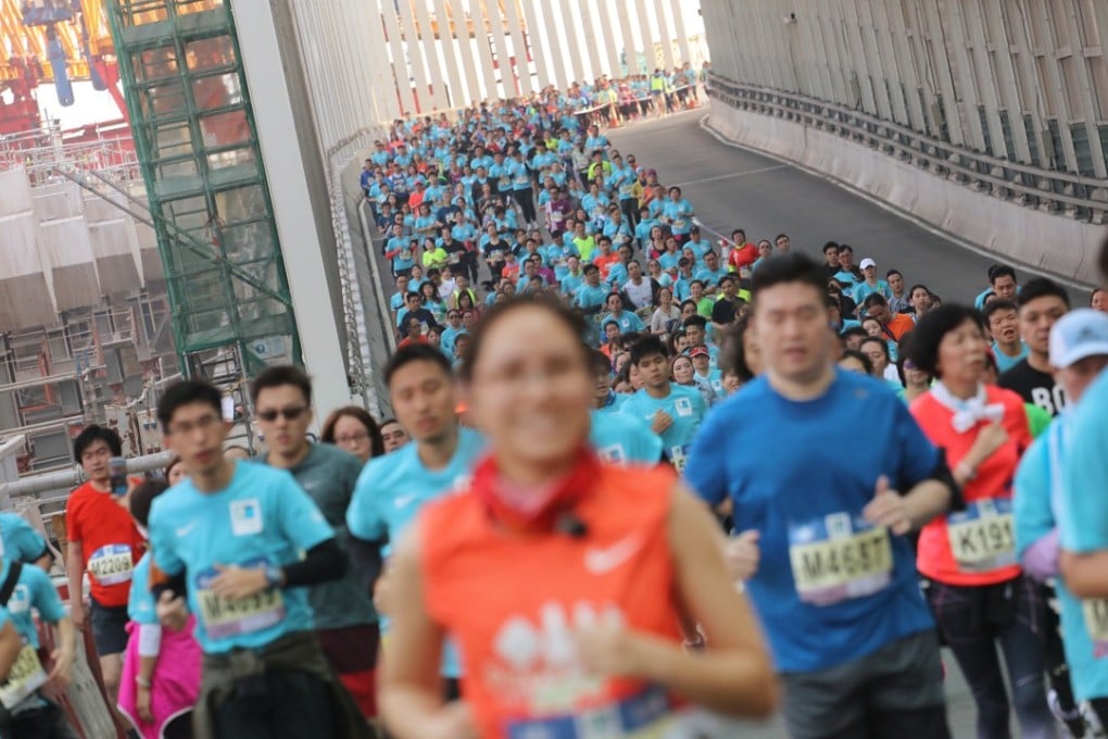 Runners at 2017 Standard Chartered Hong Kong Marathon – the growth of the event from 1,000 participants 20 years ago to 75,000 this year was highlighted by sports commissioner Yeung Tak-keung as an example of Hong Kong people’s changing attitude to sport. Photo: Felix Wong