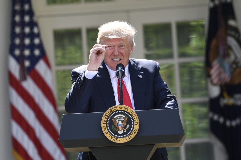 US President Donald Trump announces his decision to withdraw the US from the Paris Climate Accords. Photo: AFP