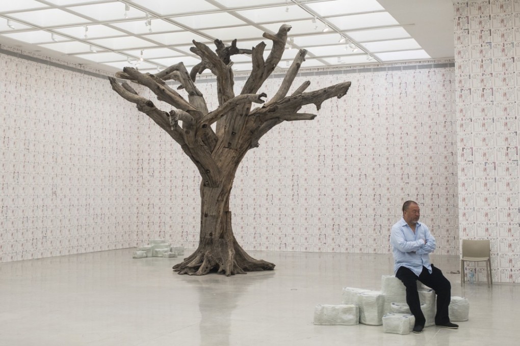 Chinese artist Ai Weiwei sits before the opening of his exhibition in the Israel Museum in Jerusalem on Thursday. Photo: AP