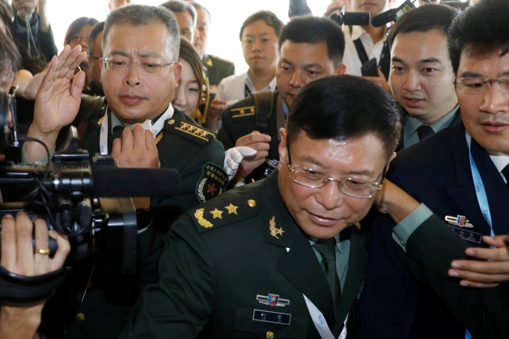 He Lei (centre), the vice-president of the Academy of Military Science, leads China’s delegation. Photo: Reuters
