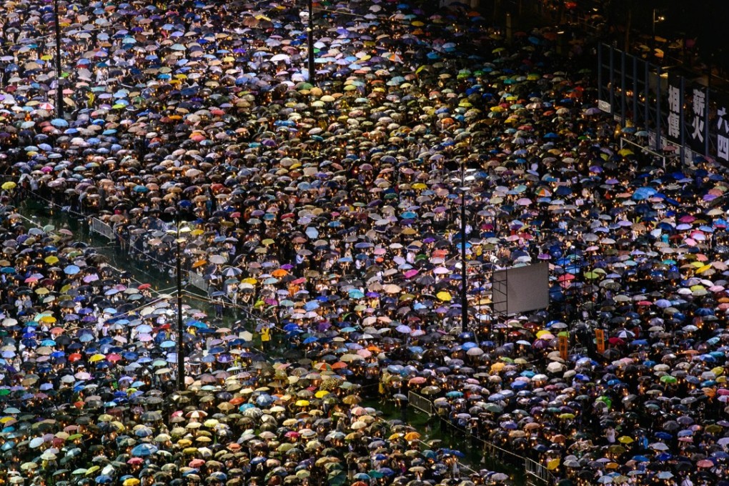 People gathered at Victoria Park during a candlelight vigil held to mark the 24th anniversary of the Tiananmen crackdown in 2013. More than 100,000 people attended the candlelight vigil, a turnout that has been steadily declining over the years. Photo: AFP
