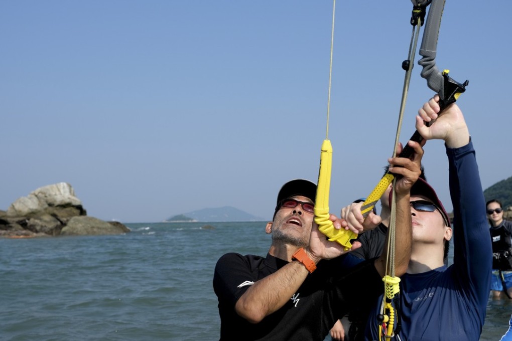 Davy Tang, owner of Hong Kong Kiteboarding School, gives lessons at Shui Hau beach in Lantau. Photo: James Wendlinger