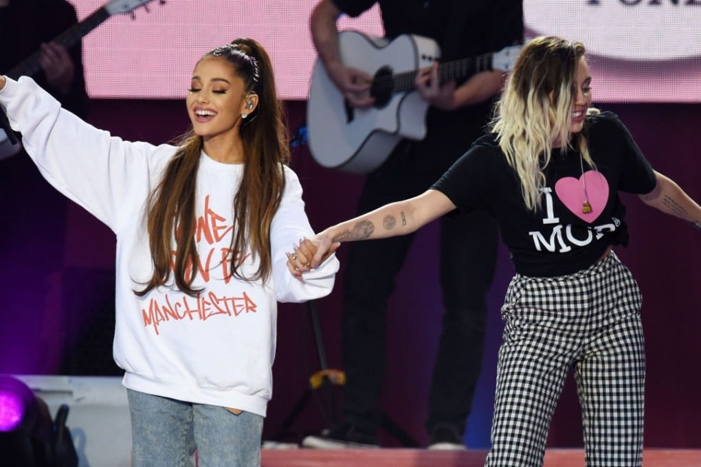 Ariana Grande (left) and Miley Cyrus perform during the One Love Manchester benefit concert on Sunday. Photo: Reuters