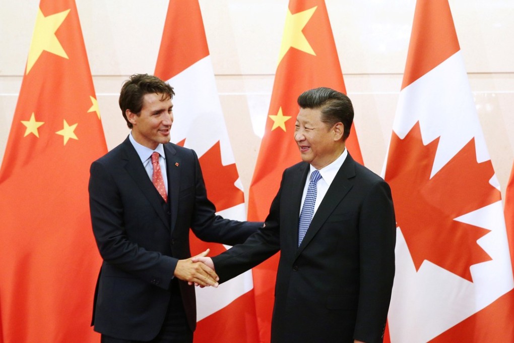 Chinese President Xi Jinping (right) shakes hands with Canadian Prime Minister Justin Trudeau ahead of their meeting at the Diaoyutai State Guesthouse in Beijing. Photo: Reuters