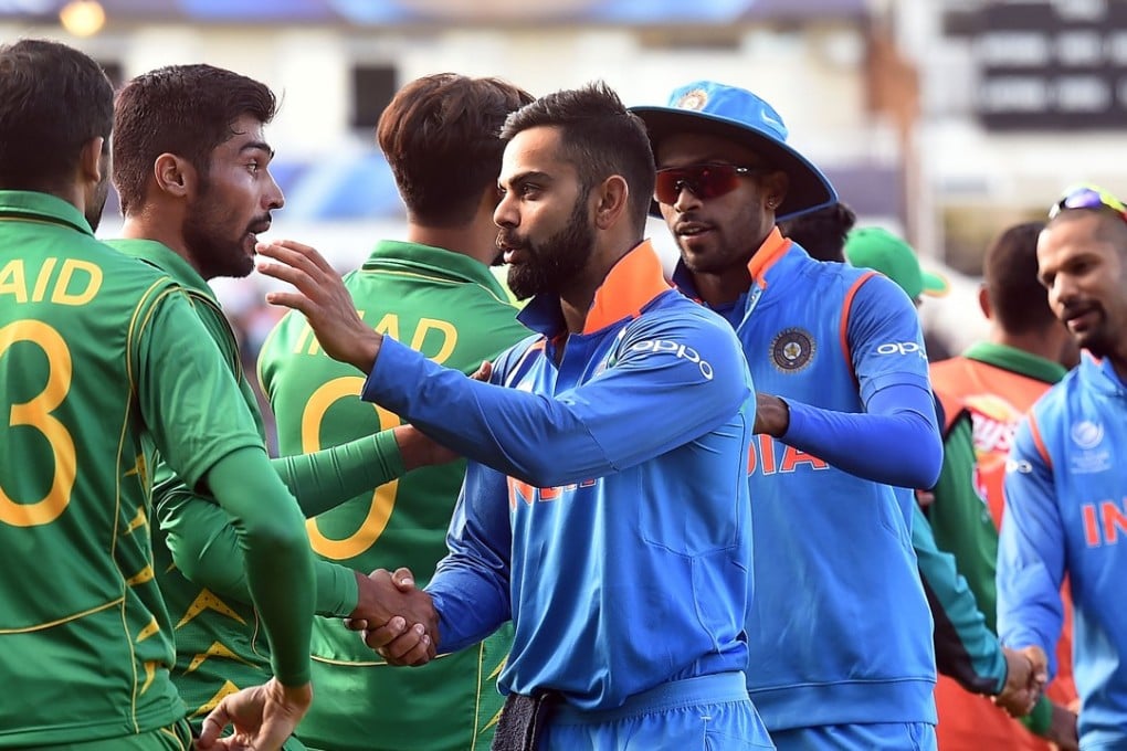 India captain Virat Kohli shakes hands with Pakistan players after their ICC Champions Trophy match. Photo: AFP