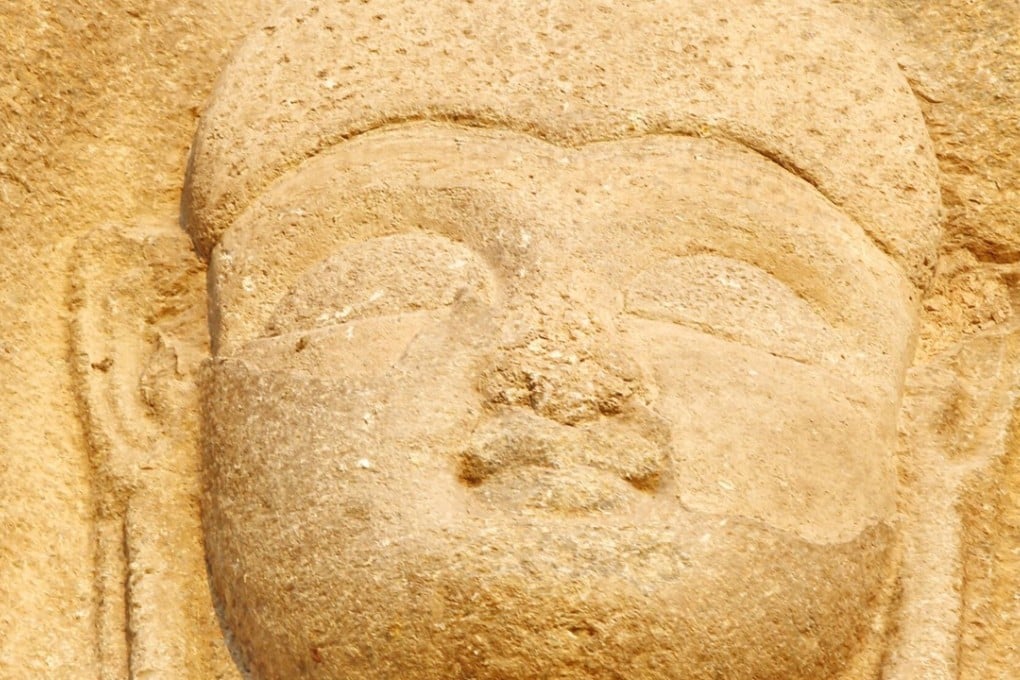 The face of a six-metre-tall Buddha rock sculpture, once vandalised and disfigured by militants in 2007, has been repaired. Photo: Kyodo