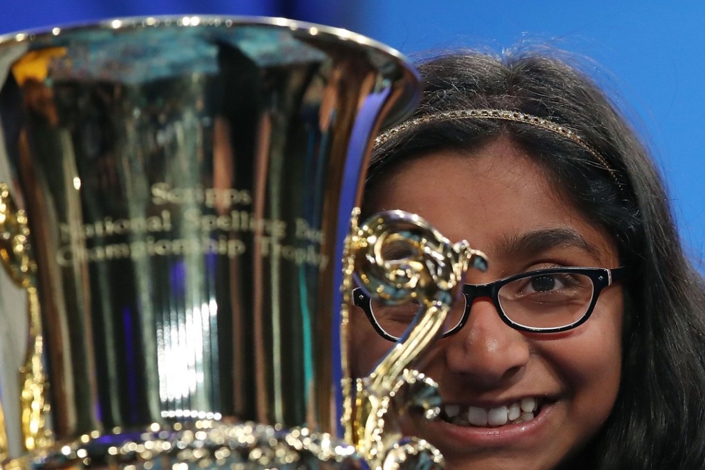 Twelve-year-old Ananya Vinay of Fresno, California, holds her trophy after winning the 2017 Scripps National Spelling Bee by spelling the word "marocain" 7 in National Harbor, Maryland. Photo: AFP