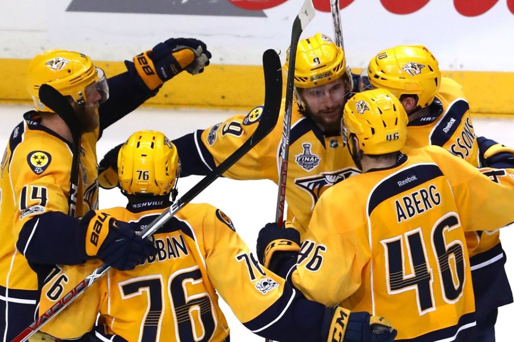Filip Forsberg of the Nashville Predators celebrates with his teammates after scoring against the Pittsburgh Penguins. Photo: AFP