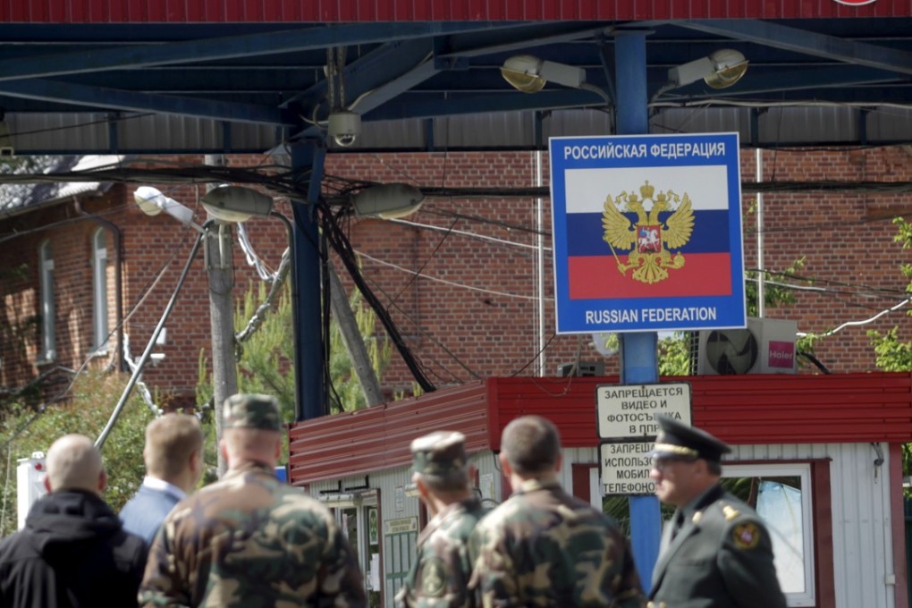 Military personnel with a view of Russia's Kaliningrad enclave border, as seen from the Sudargas border crossing in Ramoniskiai village, Lithuania. The country is beginning construction of a wire fence on its' border with Russia's Kaliningrad as the region braces for Russian military drills along the border. Photo: EPA