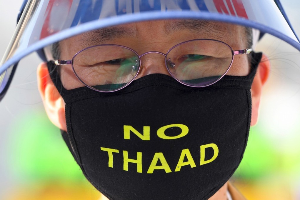 A South Korean protester wears a mask opposing the THAAD system. Photo: AFP