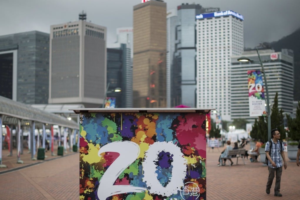 Posters celebrate the upcoming anniversary of the handover of Hong Kong, on the Central harbourfront on June 2. Photo: EPA