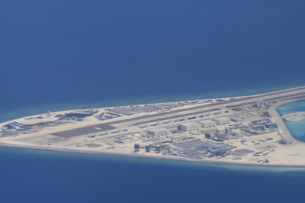Chinese structures and an airstrip are seen on the man-made Subi Reef in the Spratly islands in a photo taken in April. Photo: AP