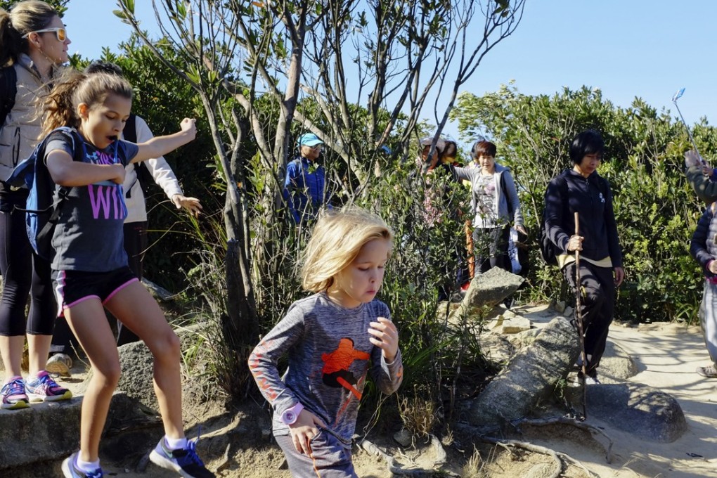 Children at the start of the popular Dragon’s Back hike on Hong Kong Island. Photo: Antony Dickson