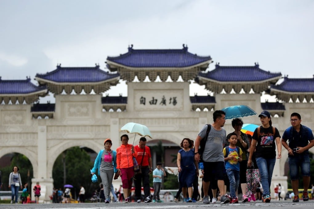 Mainland Chinese tourists outside the Chiang Kai-shek memorial hall in Taipei. Taiwan’s major attractions tend to attract groups on package holidays, while independent travellers go off the beaten track. Photo: EPA