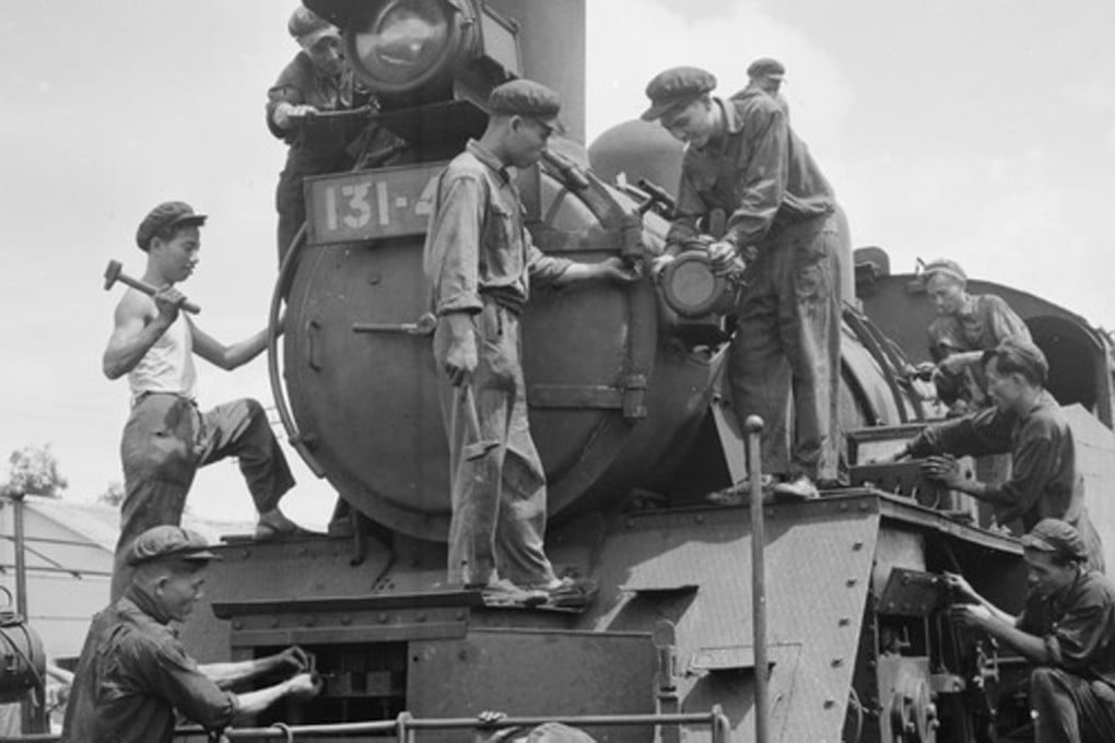 Railway maintenance workers, circa 1960, working on a train in Vietnam. Photo: Vietnam News Agency