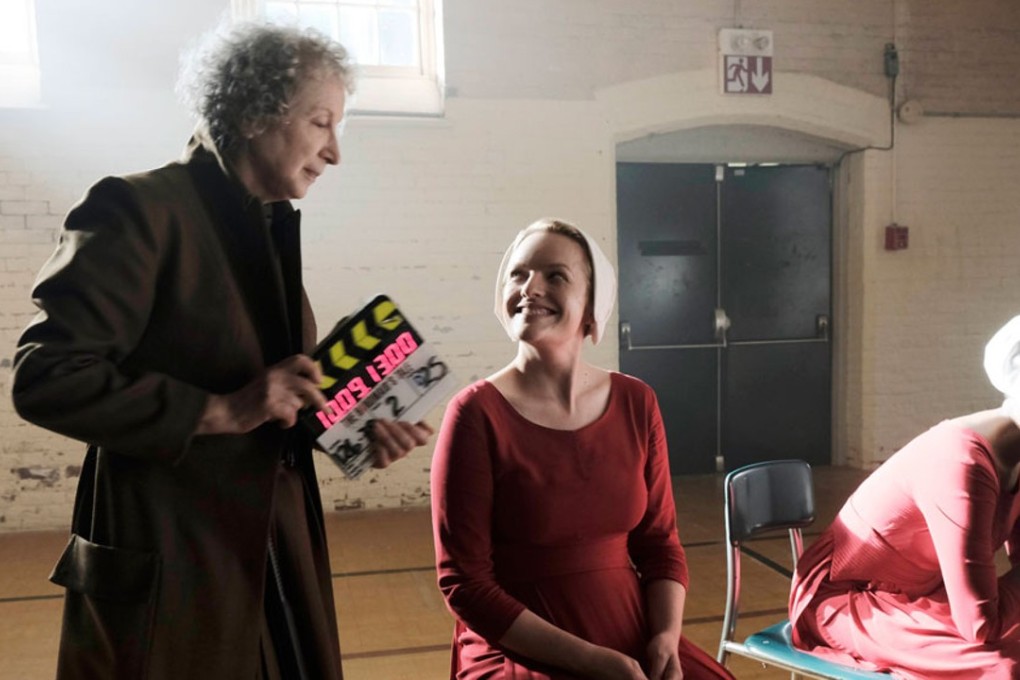 Margaret Atwood (left) consulted on – and cameos in – Hulu's adaptation of her novel The Handmaid's Tale, starring Elizabeth Moss (centre). Picture: Hulu.