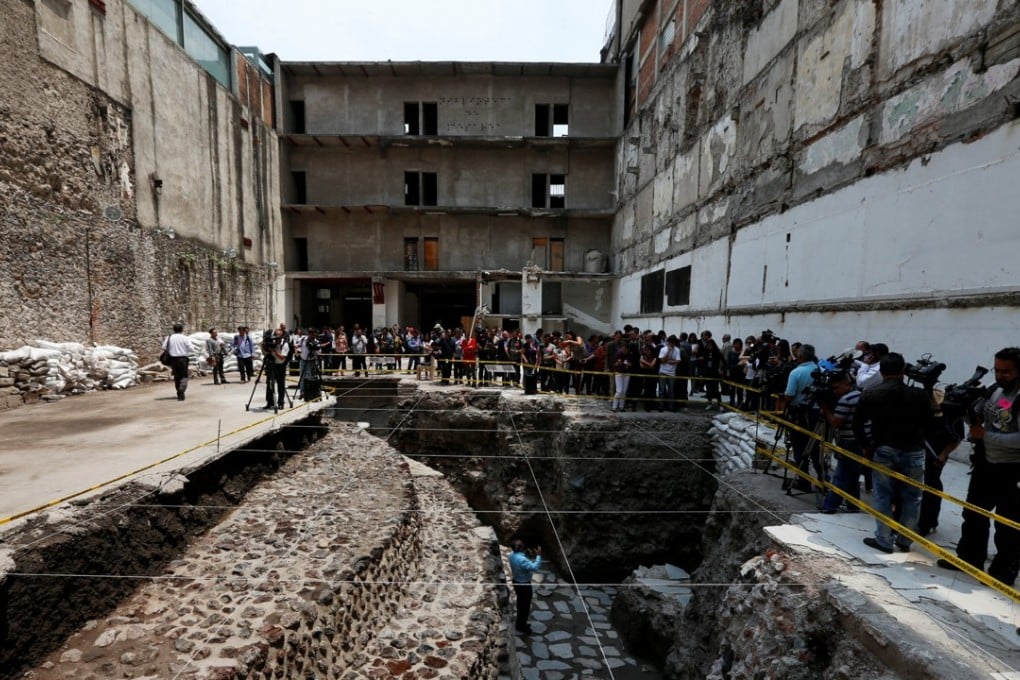 Raul Barrera, an archaeologist from the National Institute of Anthropology and History (INAH) speaks to the media about new Aztec discoveries including the main temple of the wind god Ehecatl, a major deity, as well as an adjacent ritual ball court, located just off the Zocalo plaza in the heart of downtown Mexico City on Wednesday. Photo: Reuters
