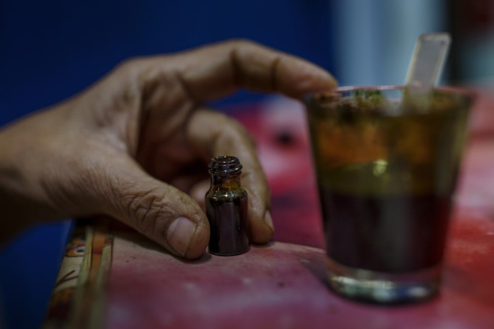 A bottle of cannabis oil at the Bangkok home of Buntoon Niyamapha. Pictures: Jonas Gratzer