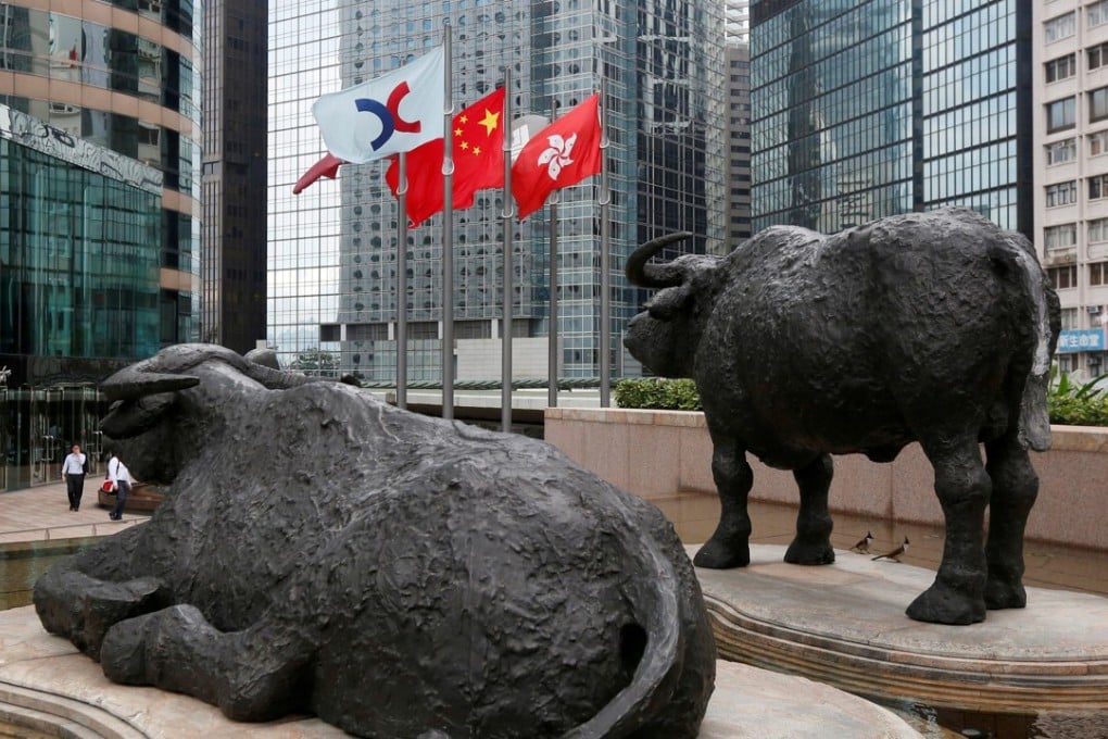 The flags of Hong Kong, China, and the Hong Kong Exchanges and Clearing, outside the city’s stock exchange. Hong Kong is still the most competitive and free economy in the world, but this standing is under threat. Photo: Reuters