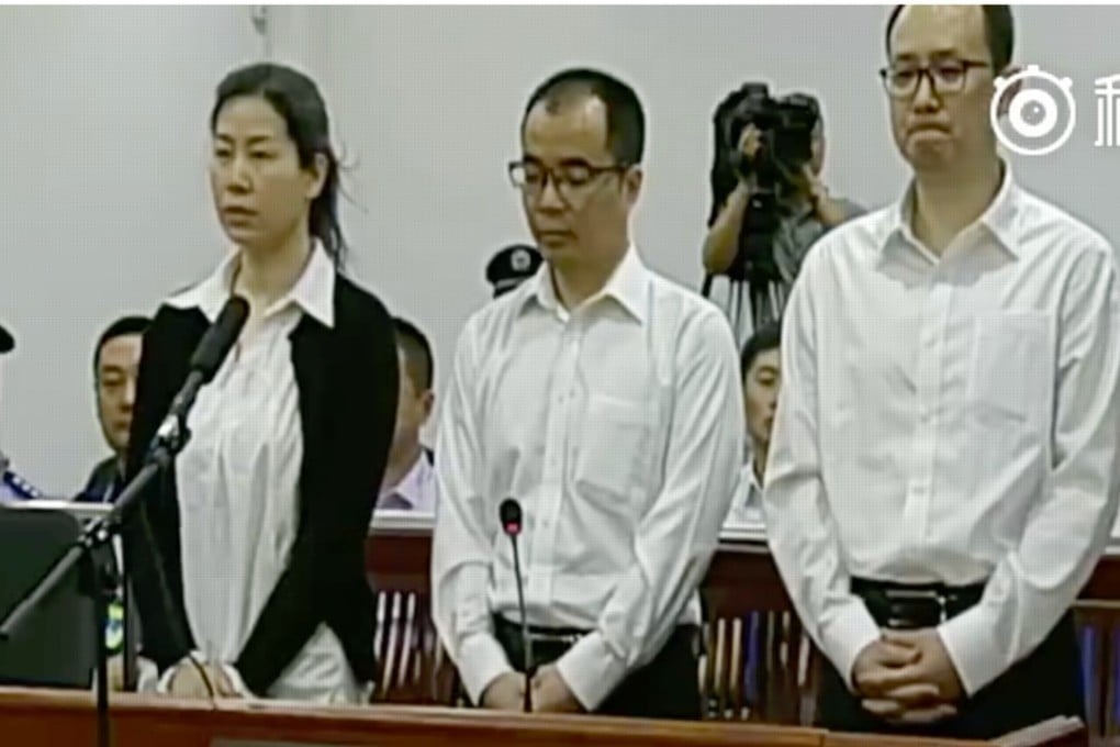 The three executives of Beijing Pangu Investment on trial in Dalian. Photo: Weibo.