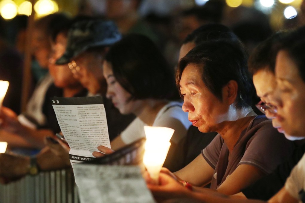 People hold a candelight vigil to commemorate June 4, in Victoria Park this year. Photo: Edward Wong