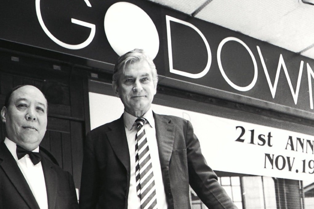 Godown’s owner Bill Nash (right) and its long-serving doorman outside the Hong Kong bar and restaurant. Picture: SCMP