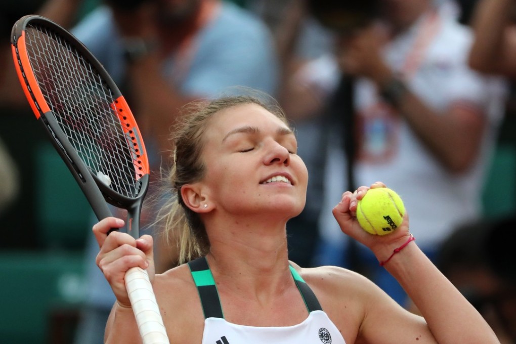 Simona Halep of Romania reacts after beating Karolina Pliskova of Czech Republic during their semi-final match. Photo: EPA