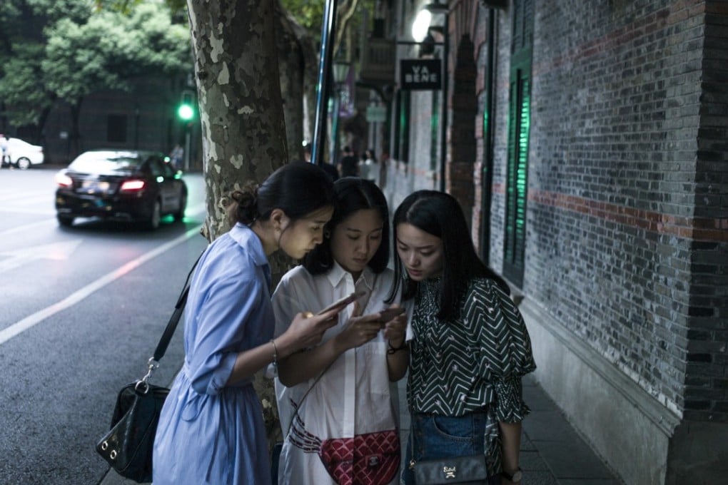 Nearly everyone in China is on their smartphone outside work, far fewer are using their handset for work - a divide not seen in other countries. Photo: AFP