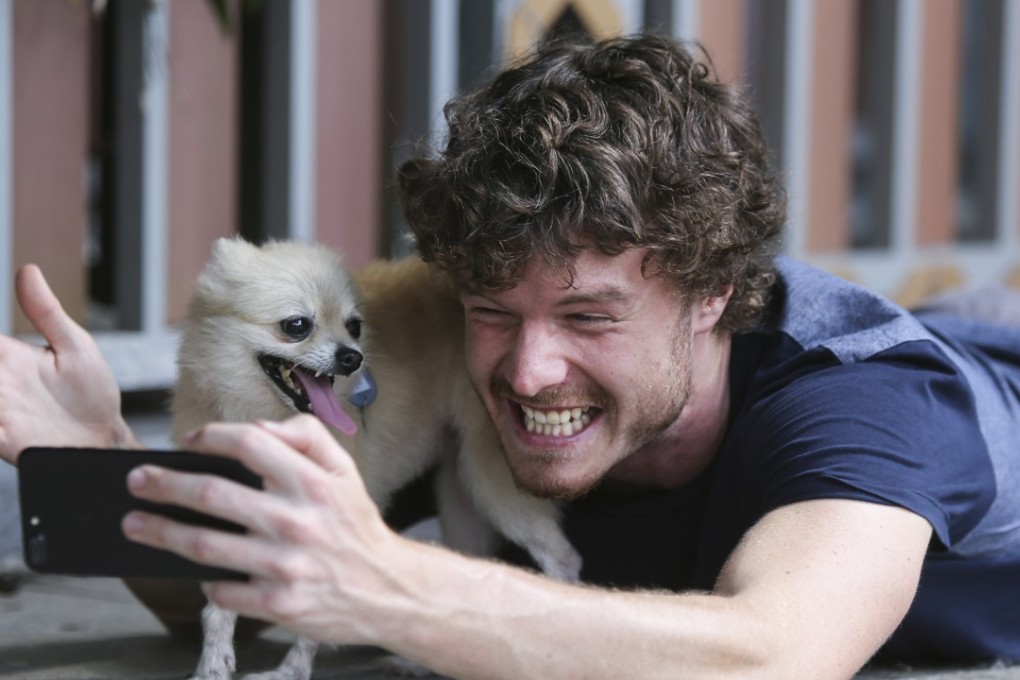 Allan Dixon takes another selfie, part of his mission to show how animals can bring happiness and joy. Photo: Xiaomei Chen