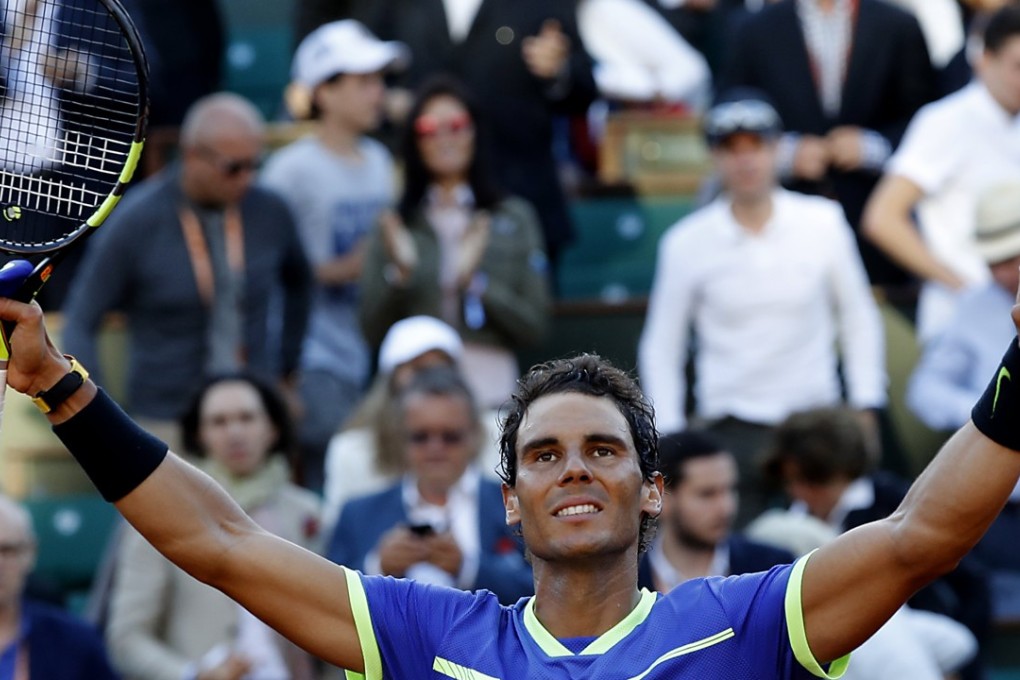 Rafael Nadal reacts after winning against Dominic Thiem at the French Open. Photo: EPA