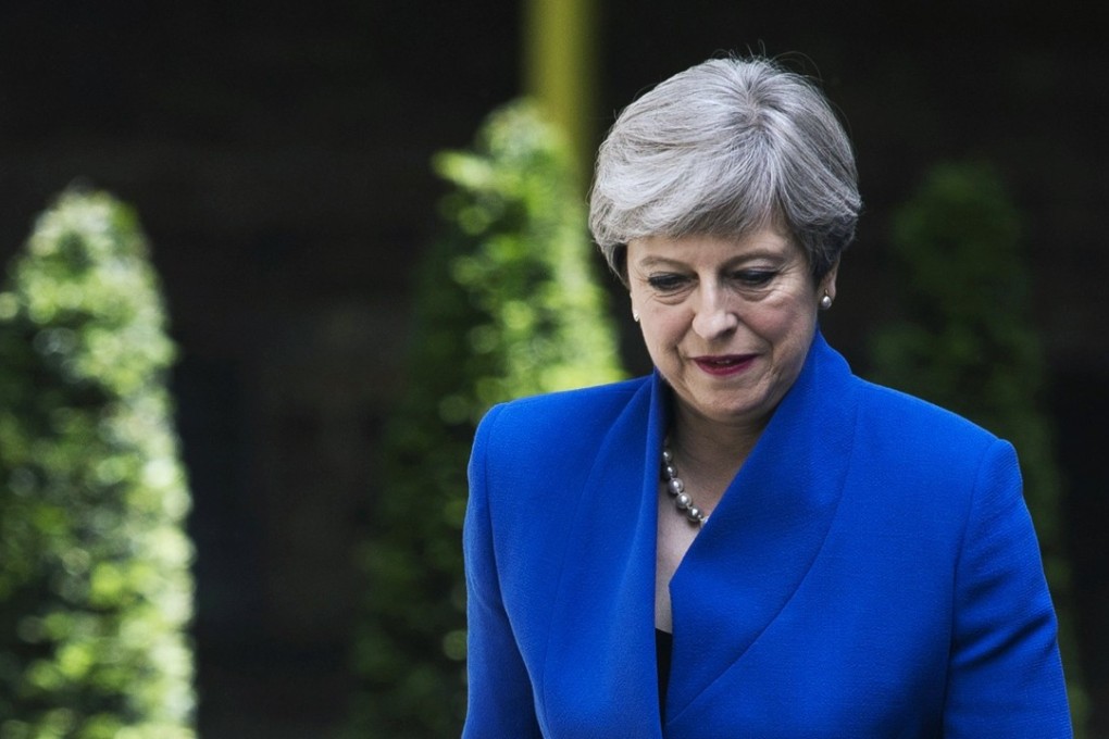 Britain's Prime Minister Theresa May arrives at No 10 Downing Street after meeting the Queen in Buckingham Palace on Friday. Photo: EPA
