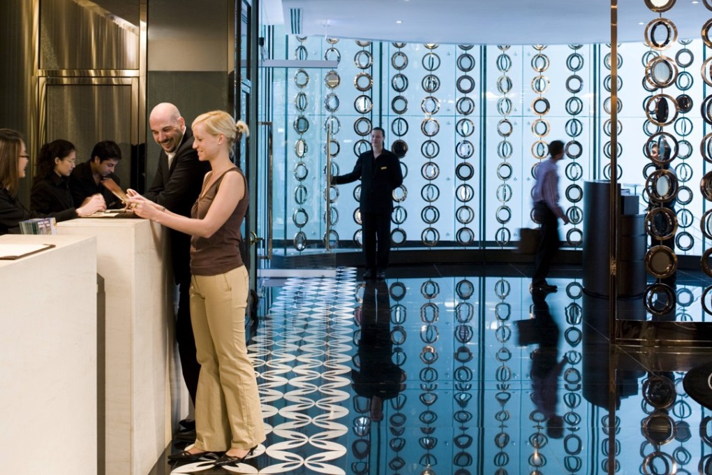 Guests check in at Hotel LKF in Central. Its website is no longer accepting bookings from July. Photo: Handout