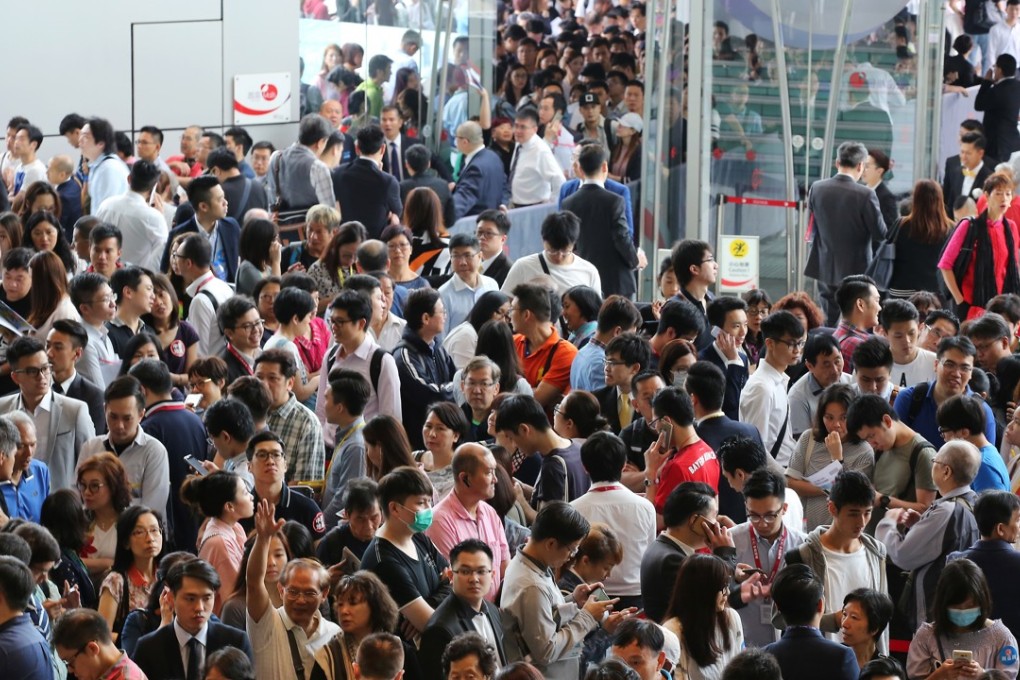 Potential buyers flock to a sales office for the latest property offering. Photo: Edward Wong