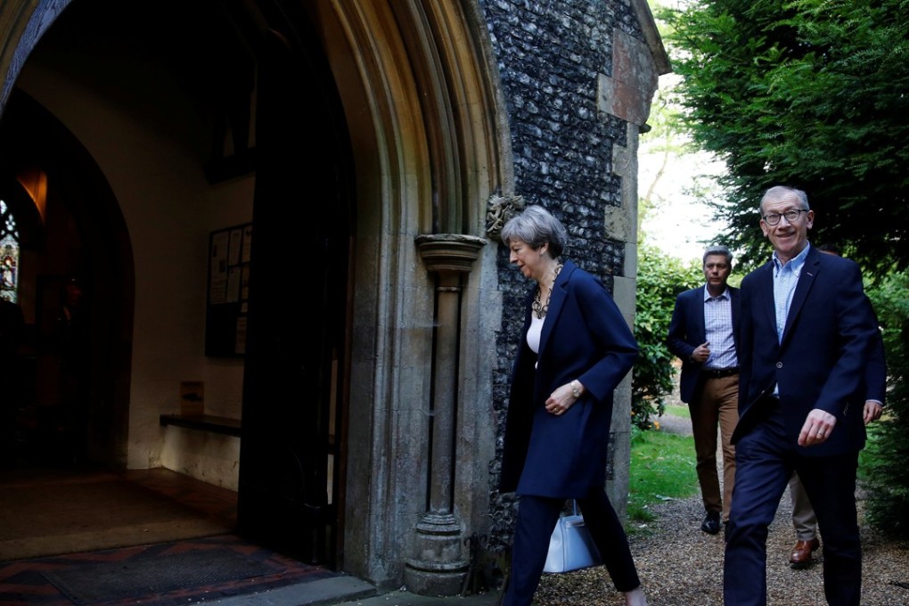 Britain's Prime Minister Theresa May and her husband Phillip arrive at church in Sonning, Berkshire, on June 11. Photo: Reuters