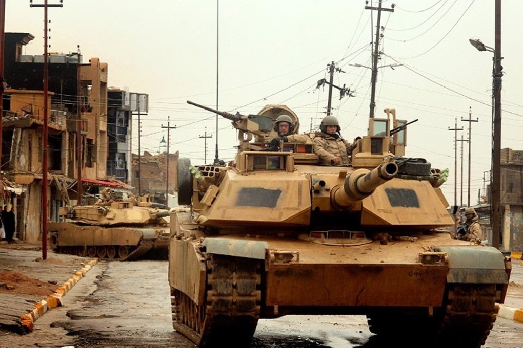 US Army M1A2 Abrams tanks conduct a combat patrol in the city of Tall Afar, Iraq, on February 3, 2005. Photo: Wikimedia Commons