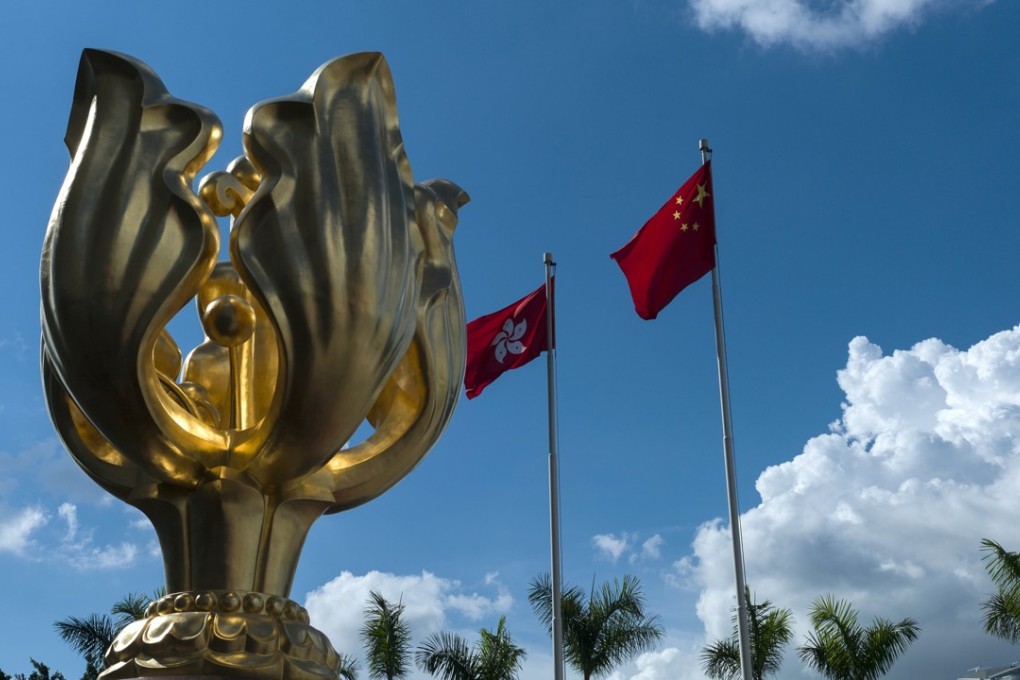 The flags of Hong Kong and China fly next to the Golden Bauhinia statue at the Convention and Exhibition Centre in Wan Chai. Hong Kong’s new government would be well advised to focus on the different projects involved in the belt and road plan. Photo: EPA