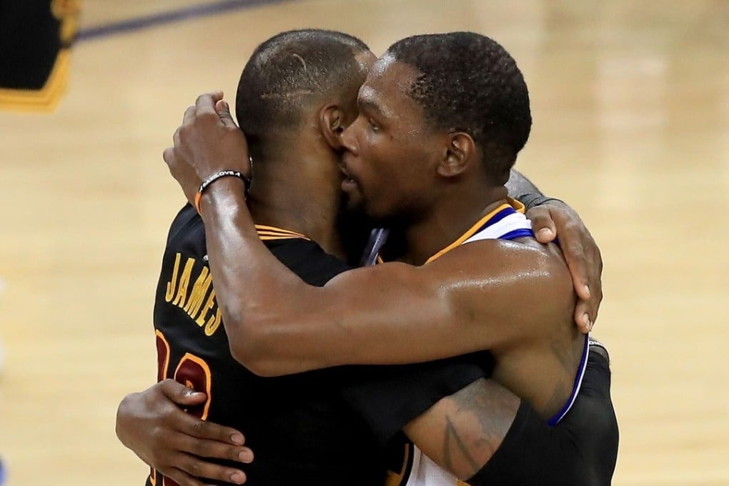Kevin Durant hugs LeBron James after game five. Photo: AFP
