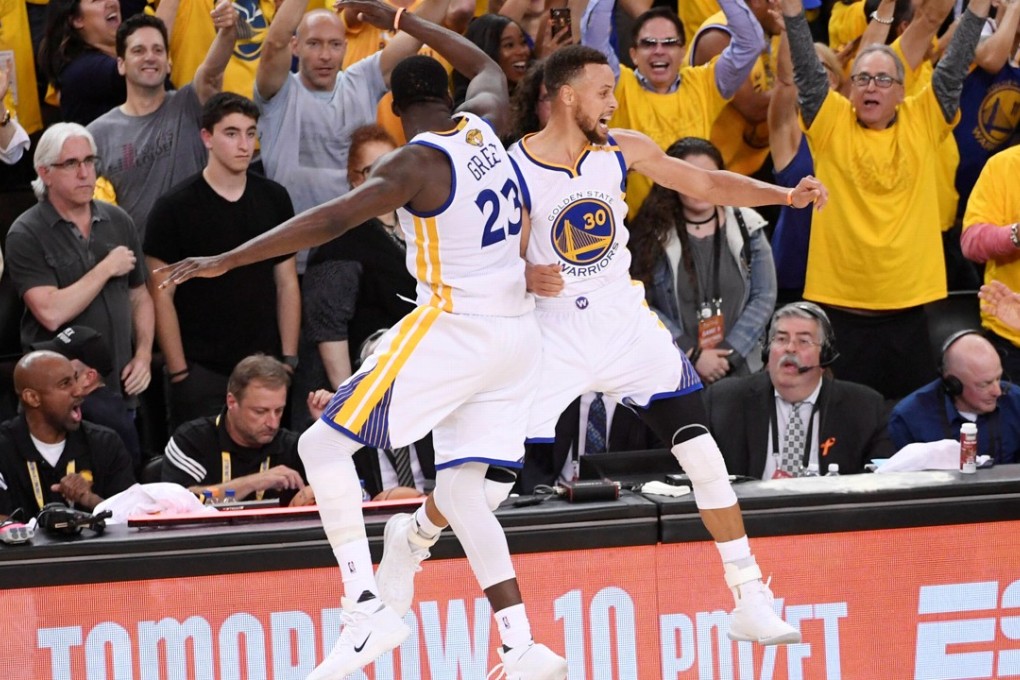 Golden State Warriors guard Stephen Curry celebrates with forward Draymond Green after sealing the NBA championship. Photo: USA Today