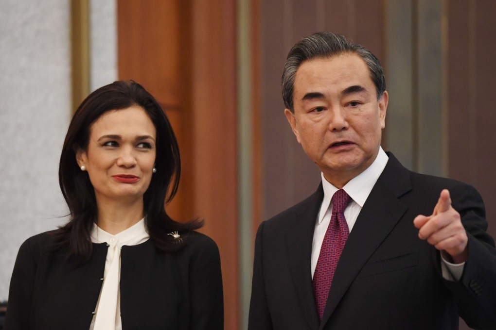 Panama's vice-president and Foreign Minister Isabel de Saint Malo (left) and Foreign Minister Wang Yi chat during a ceremony on establishing diplomatic relations in Beijing on Tuesday. Photo: AFP